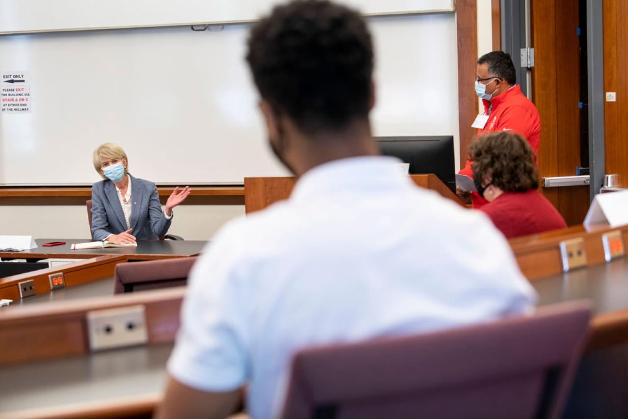 Image of President Johnson speaking with students and faculty in a classroom
