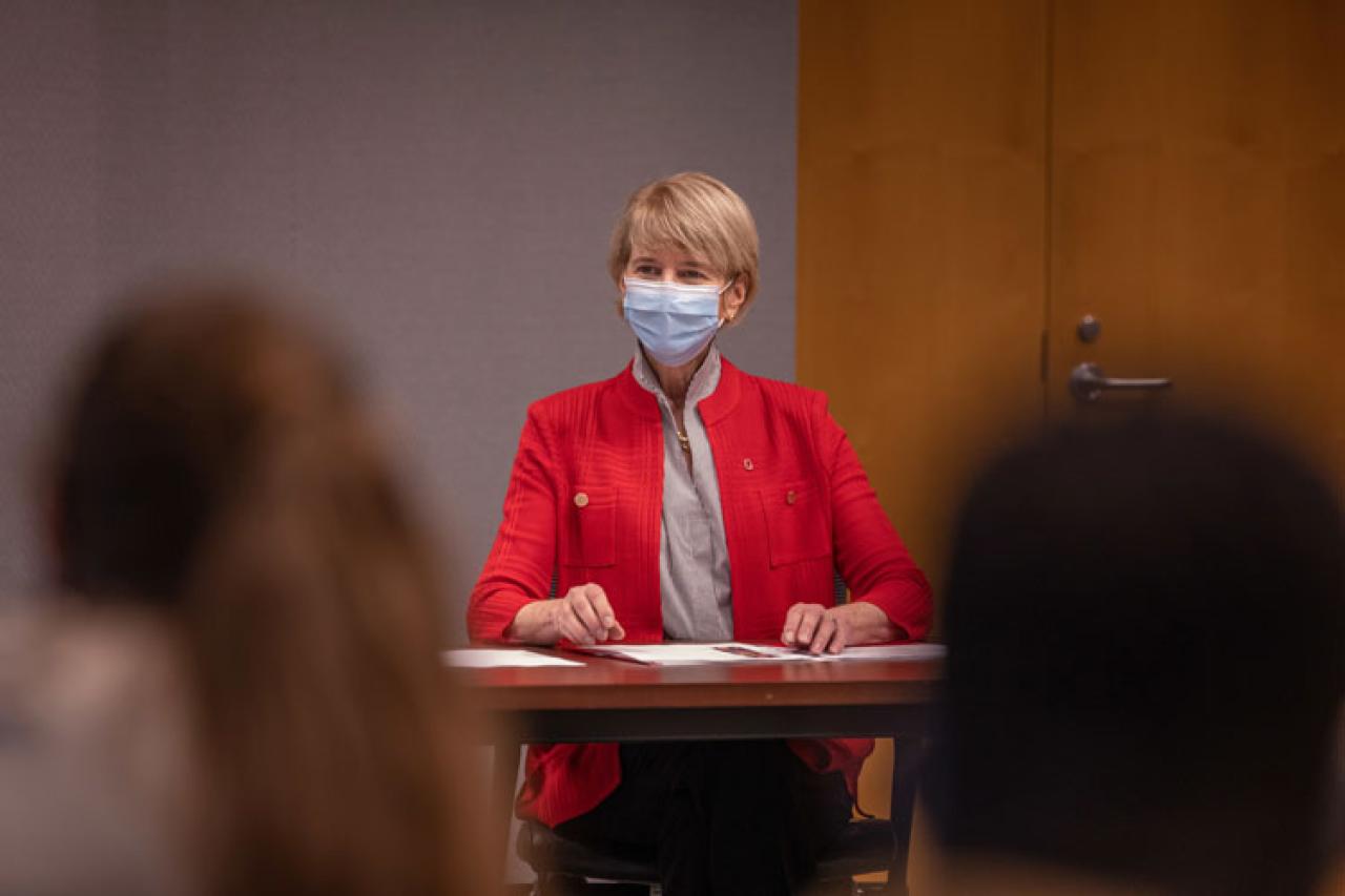 Image of Ohio State President Kristina M. Johnson seated at table during a visit to the Moritz College of Law