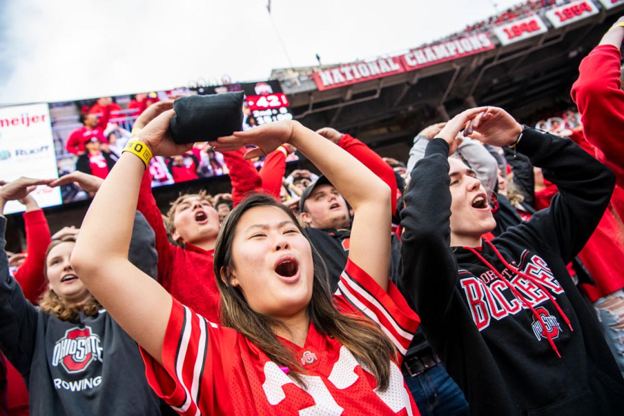 Students cheering during and Ohio State Buckeyes football game