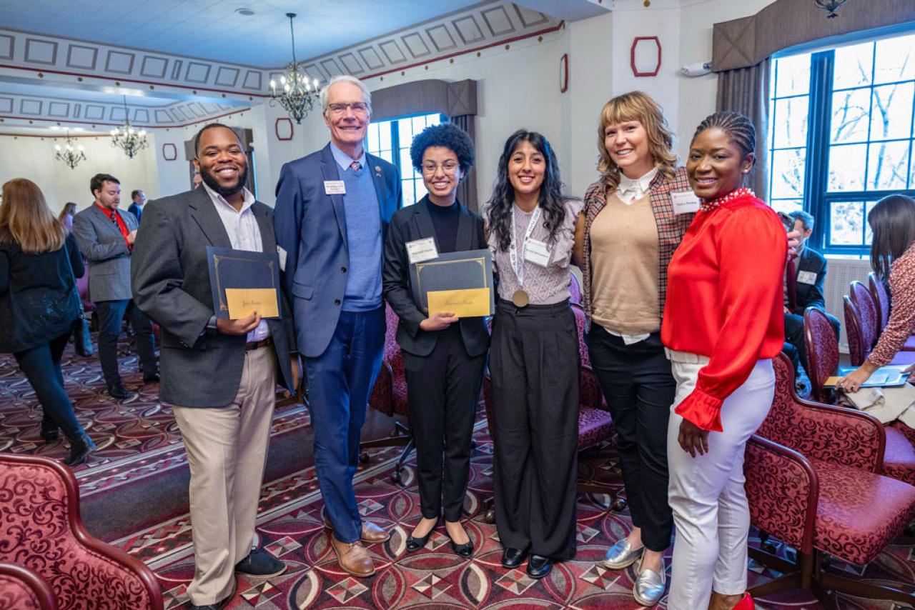 Students and faculty posing for a photo at the Denman Undergraduate Research Forum