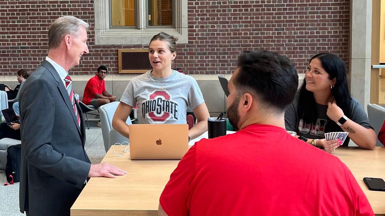 Ohio State President Ted Carter speaking with med students in Hamilton Hall