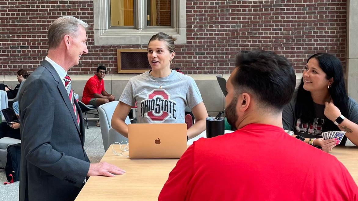 Ohio State President Ted Carter speaking with med students in Hamilton Hall