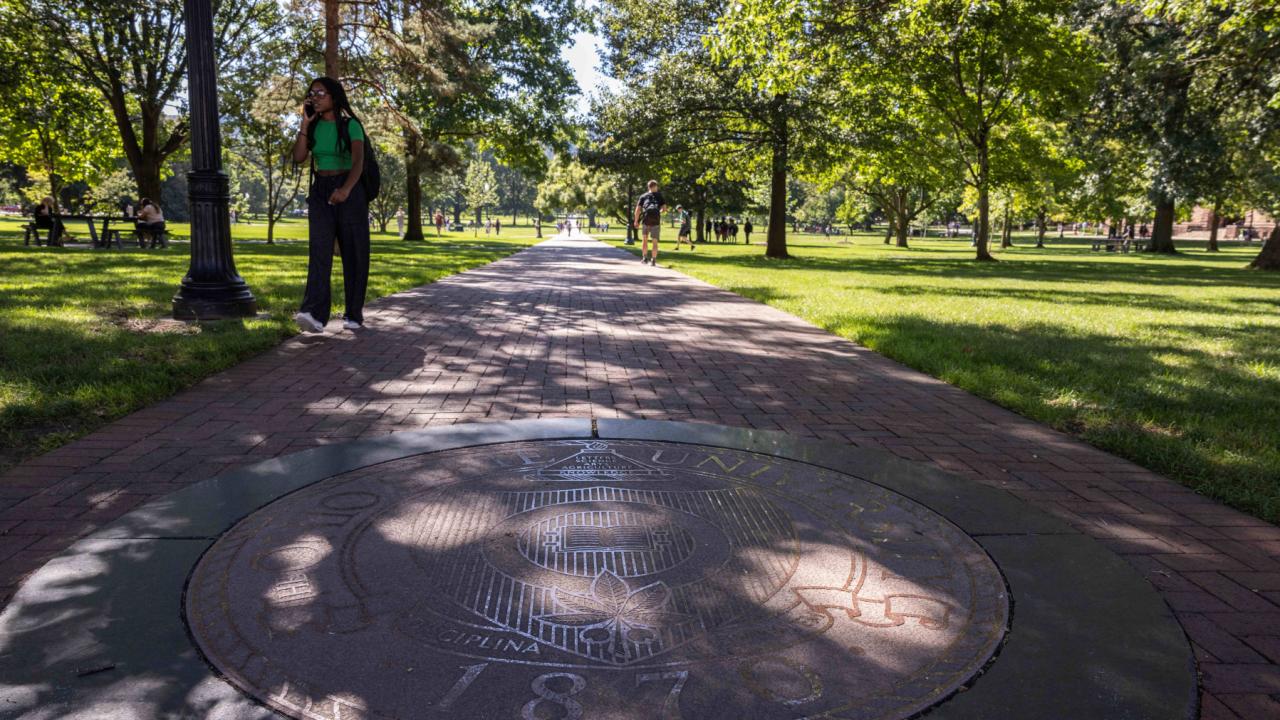 The Ohio State University's seal in the sidewalk on the east end of the Oval