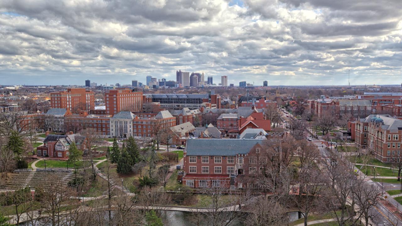 The high rises of downtown Columbus rise in the background of an aerial photo of the Columbus campus